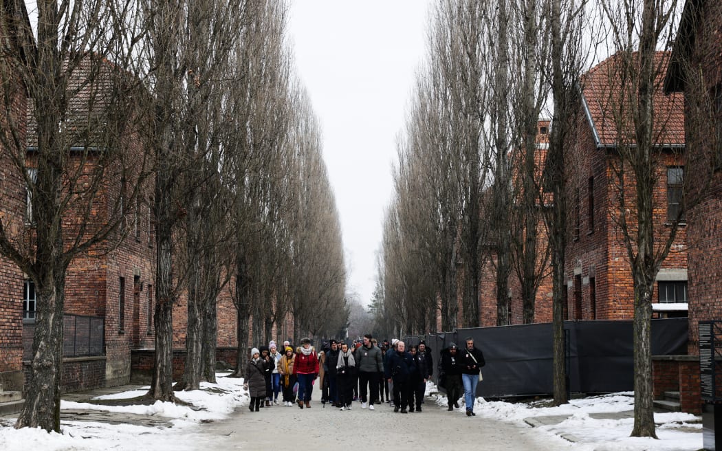 Visitors at the former Nazi German concentration camp Auschwitz-Brikenau in Oswiecim, Poland on 21 January 2025. (Photo by Jakub Porzycki/NurPhoto) (Photo by Jakub Porzycki / NurPhoto / NurPhoto via AFP)