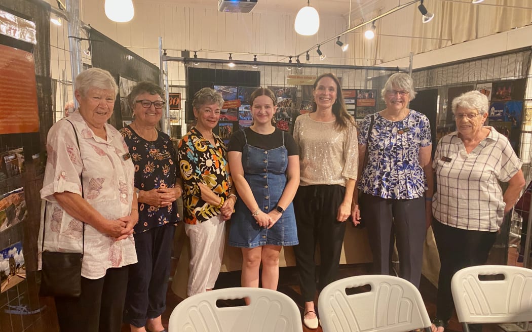 Members of the Waihī Arts Centre and Museum at the opening of 'Waihī Unfolded'. Bella Paulsen in the centre, with Anne Marie Spicer to her right.