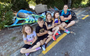 Macey Albrecht, 6, Declan Albrecht, 8, Tyla Albrecht, 10, Amber Albrecht, 8, with their mother, Kelly Albrecht. The group discovered the dumped rubbish, near the Rotorua International Stadium, while arriving for training there on Monday.