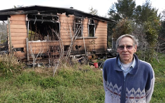 Arnold Kalnins outside the remains of his home, just east of Kaikohe.