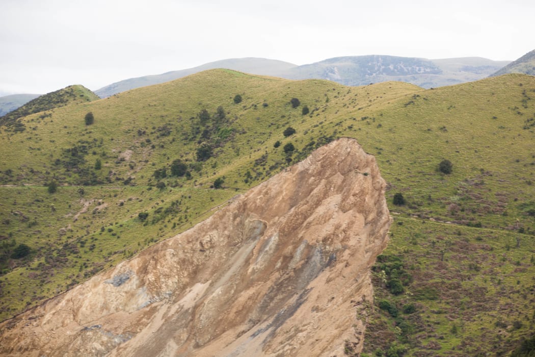 The slip above the Leader River where a whole side of a hill has fallen away creating a blockage that now has a volume of water stuck behind it.