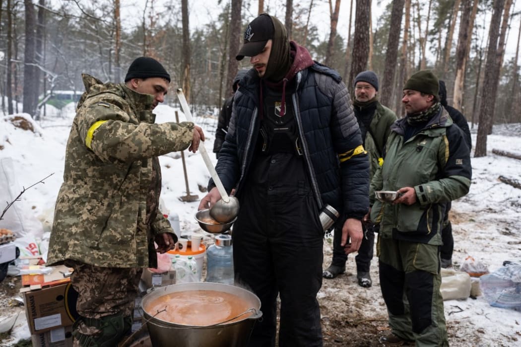 Ukrainian servicemen are seen outside of Kyiv on 1 March, 2022 - the sixth day of Russian attacks on Ukraine.