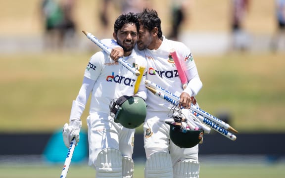 Bangladesh's captain Mominul Haque (L) with team mate Mushfiqur Rahim celebrate win over Black Caps.