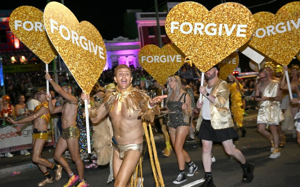 People participate in the 45th Sydney Gay and Lesbian Mardi Gras Parade in Sydney on February 25, 2023. (Photo by Saeed KHAN / AFP)