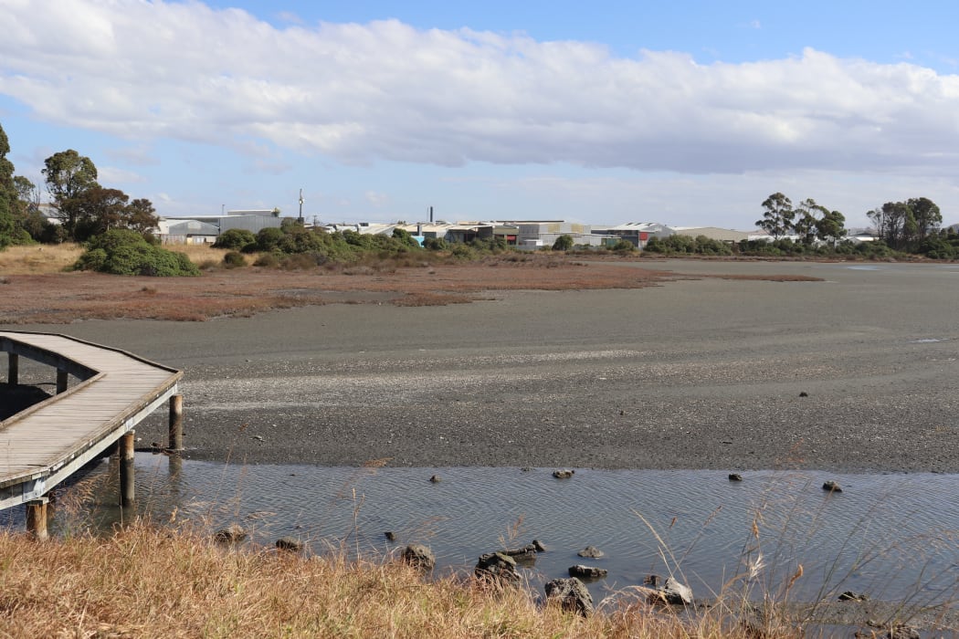A large industrial area borders part of the estuary.