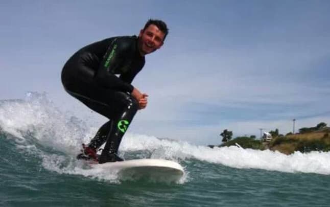 Darren Mills was a keen surfer before the shark attack.