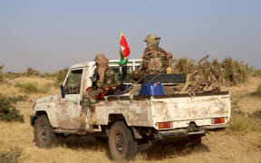 Coalition of the People of Azawad (CPA) fighters are seen on a Land Cruiser while patrolling the area near the Mali-Mauritania border to protect local populations from insecurity related to unrest caused by bandits.