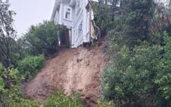 A slip on Laura Avenue in the Wellington suburb of Brooklyn blocks the road and undermines part of a house.