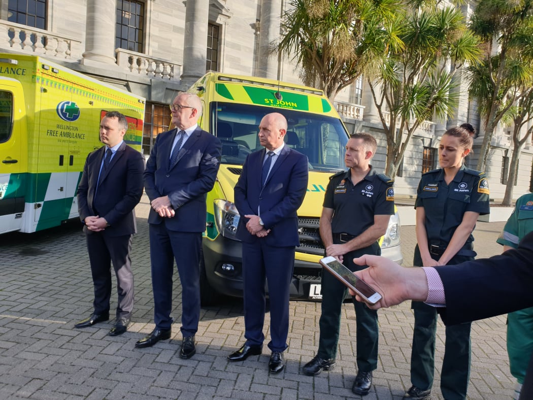 St John CEO Peter Bradley (second from left) and Wellington Free CEO Mike Grant (centre) with ambulance officers and staff at Parliament today.