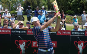 Jordan Spieth tries a cricket bat in Australia, November 2015.