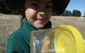 Burnside Primary student Valentina, with a Boulder Butterfly.