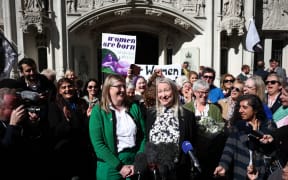 Susan Smith (L) and Marion Calder, Directors of For Women Scotland make a statement outside Britain's Supreme Court in London on April 16, 2025, following the court's ruling on how to define a 'woman'. Britain's Supreme Court said the legal definition of a "woman" is based on a person's sex at birth, a landmark ruling with far-reaching implications to the bitter debate over trans rights. In a win for Scottish gender-critical campaigners who brought the case to the UK's highest court, five London judges unanimously ruled "the terms 'woman' and 'sex' in the Equality Act 2010 refer to a biological woman, and biological sex". (Photo by HENRY NICHOLLS / AFP)