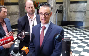 David Clark talks to media at Parliament.