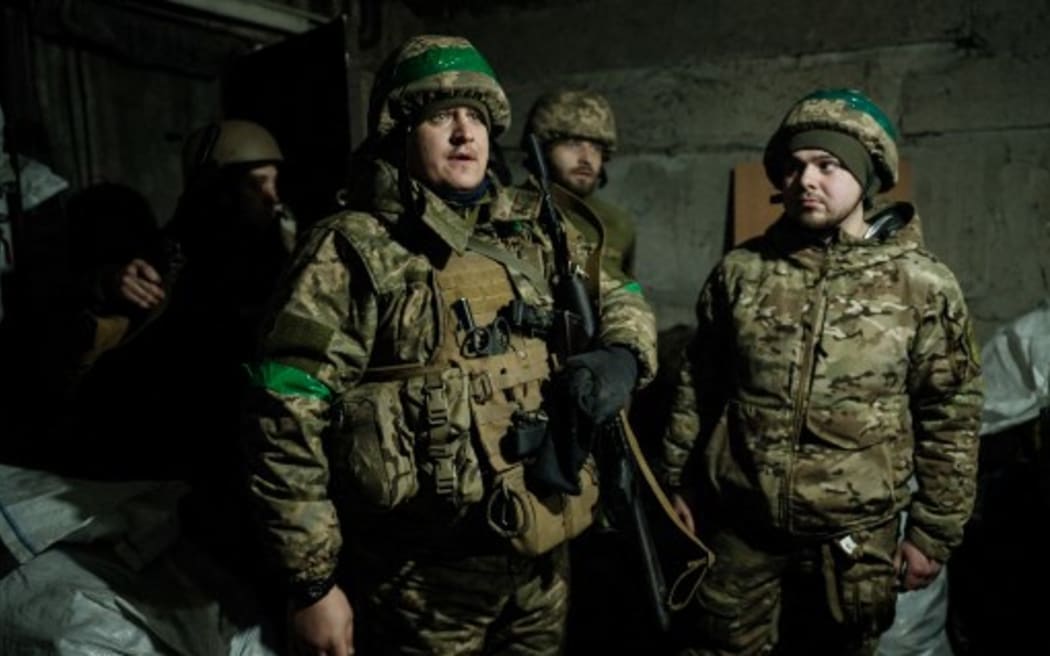 Ukrainian servicemen of the State Border Guard Service at a shelter in Bakhmut on February 16, 2023.
