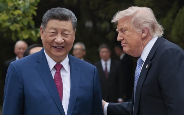 US President Donald Trump (R) speaks with China’s President Xi Jinping as he leaves after a visit to Zhongnanhai Garden in Beijing on May 15, 2026. (Photo by Evan Vucci / POOL / AFP)