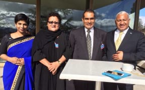 Fiji's Prime Minister Frank Bainimarama at the United Nations office in Geneva with Nazhat Shameem Khan in blue.