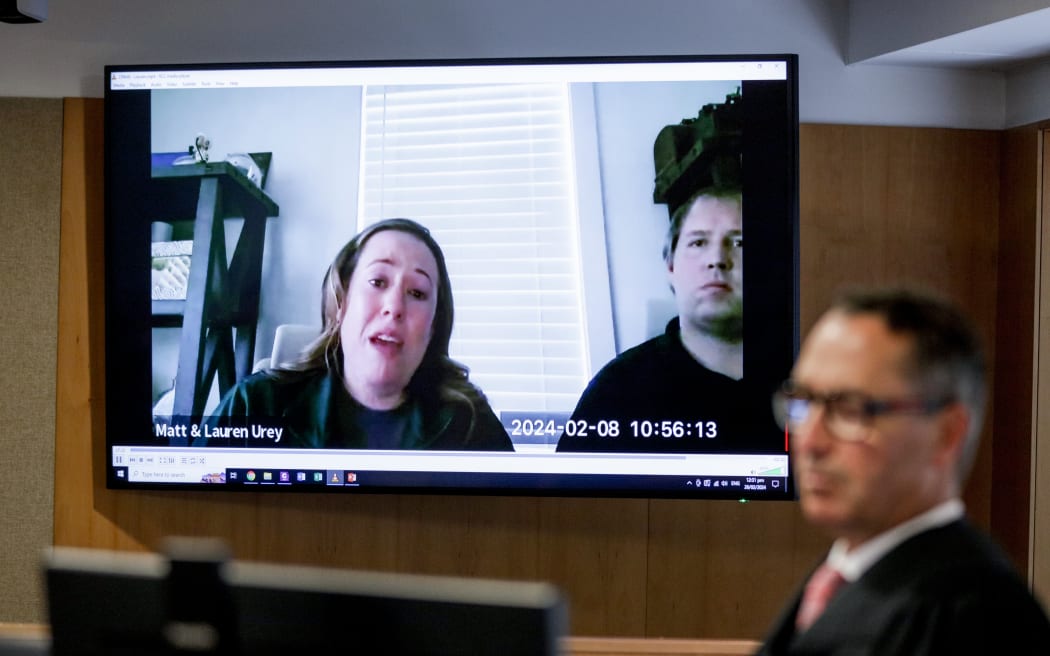 Judge Evangelos Thomas listens to victims Matt and Lauren Urey's prerecorded statement at at the Whakaari sentencing hearing in the Environment Court, Auckland, 26 February 2024.