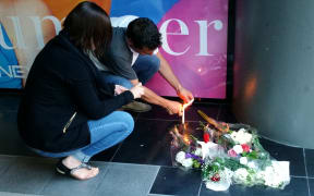 Organiser Pascal Line and Laurent Loudeac light candles.