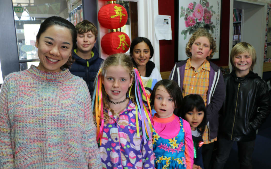 Te Aro Primary students with MLA Chinese teacher Jingwen Zhang.