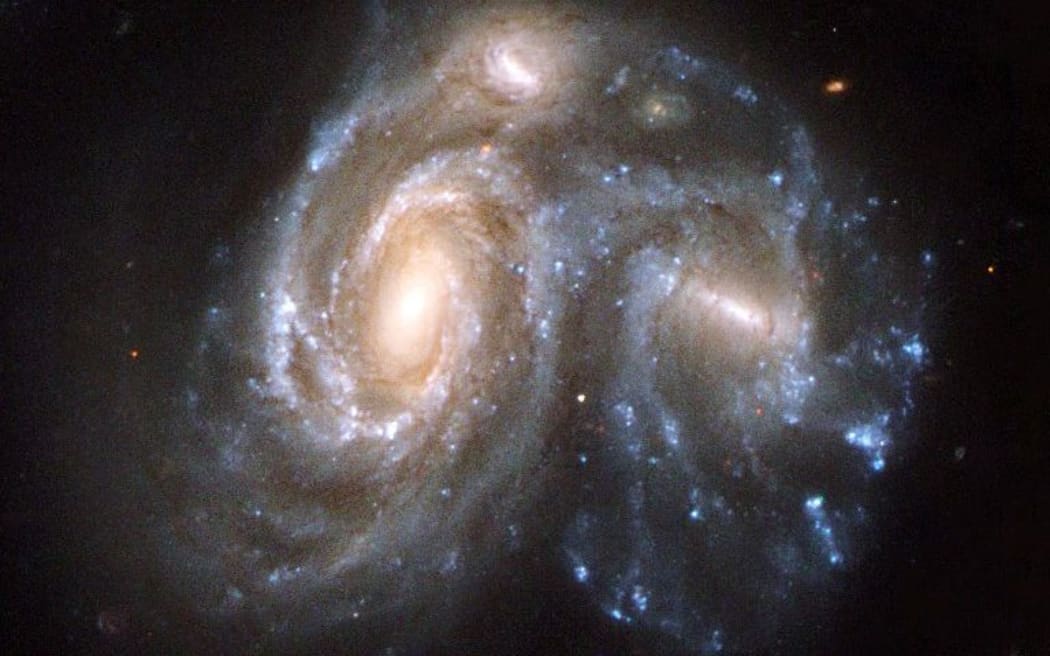 Picture released on April 24, 2008 by ESA shows the Arp 272, a collision between two spiral galaxies, NGC 6050 and IC 1179 part of the Hercules Galaxy Cluster and located in the constellation of Hercules, taken by the Hubble Space Telescope