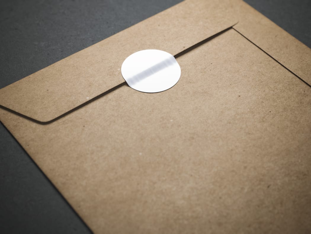 Yellow envelope with blank sticker on it