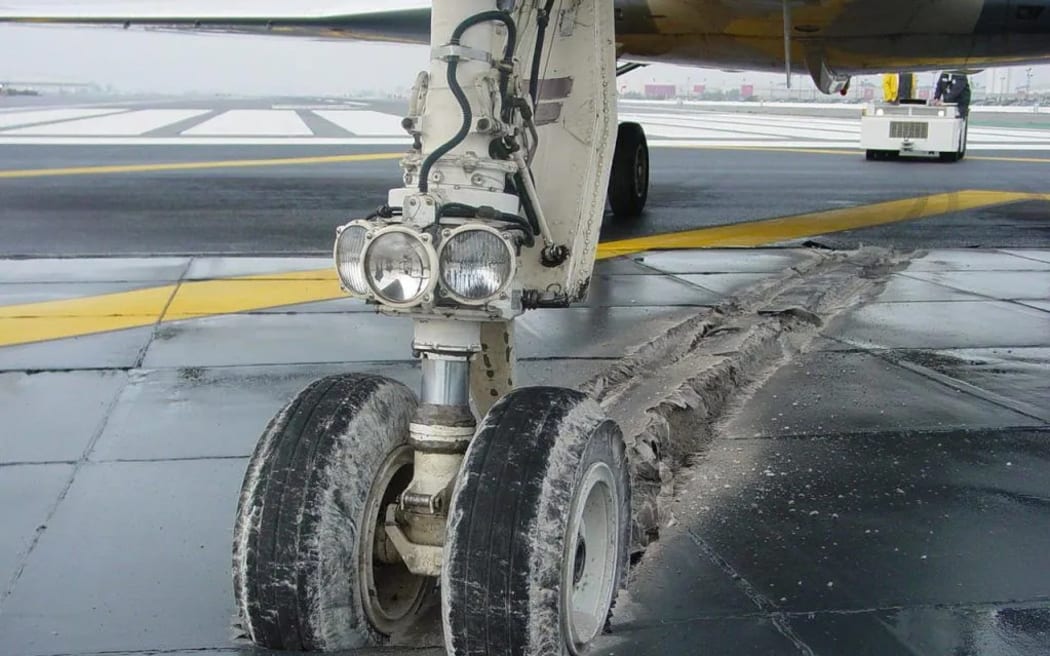 The landing gear of an aircraft that was brought to a safe stop by EMAS technology.