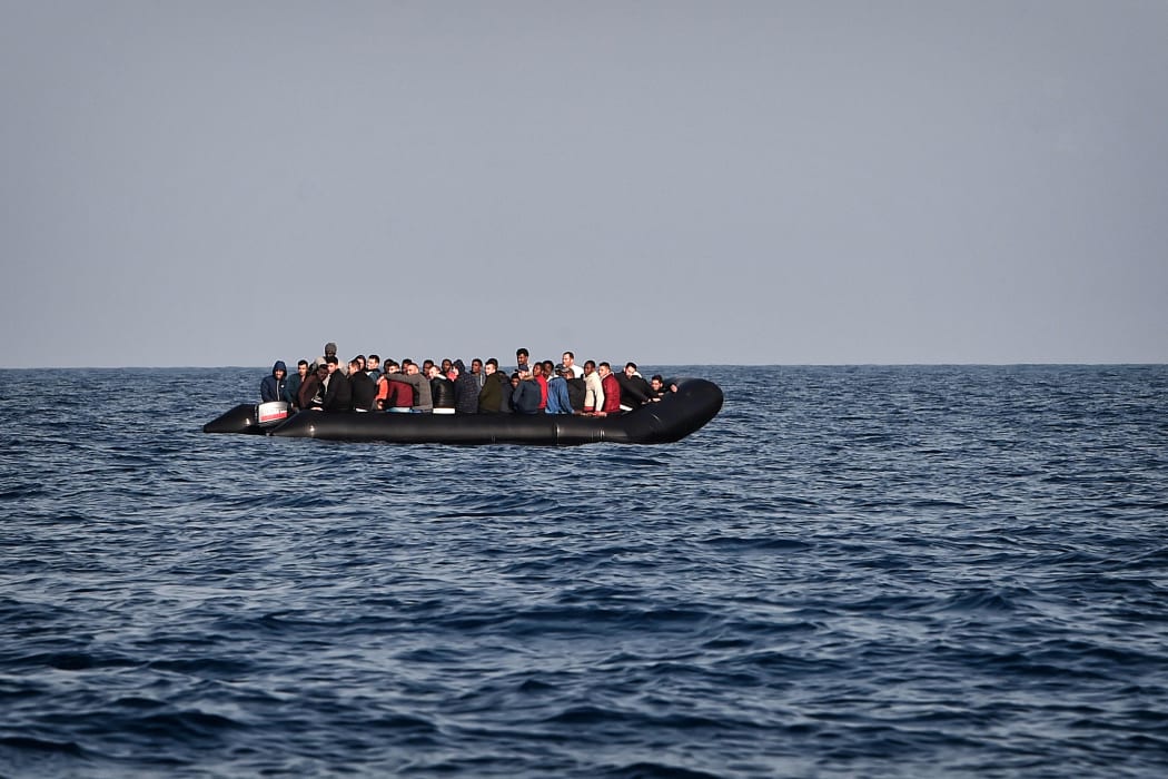 A rubber boat with migrants is seen off the Libya coast (file image).