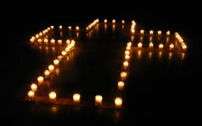 Cross of candles - arrangement made by Yun-Yu Hsieh and people from Austin Chinese Campus Christian Fellowship (ACCCF) at Gonzales, Texas, USA