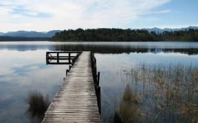 Department of Conservation/SUPPLIED
Lake Māhinapua at Shanghai Bay Jetty. Mana whenua in the area have reminded the Te Tai o Poutini Plan committee of the sacred (tapu) status of the picturesque lake.