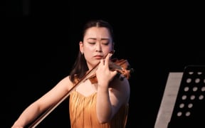 Aoi Saito performs at the Michael Hill International Violin Competition.