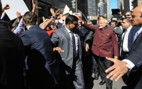 Indian Prime Minister Narendra Modi greets people on the streets of New York.
