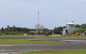The runway and air traffic control tower at Funafuti airport, the only airport in Tuvalu.