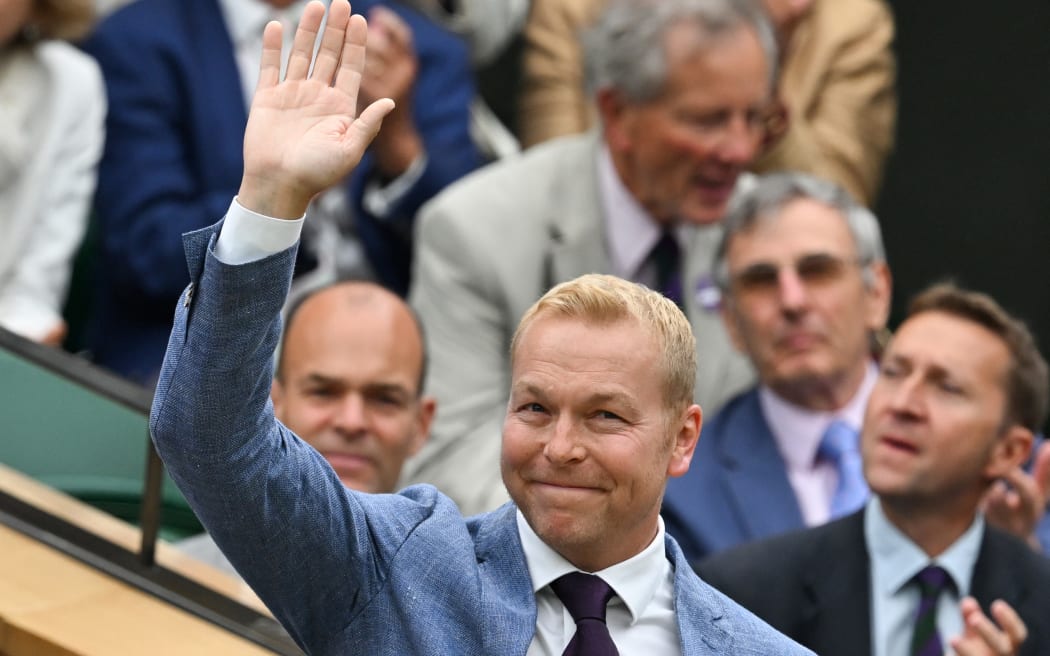(FILES) British cyclist Chris Hoy waves to the crowd from the Royal box on Centre Court during the sixth day of the 2024 Wimbledon Championships at The All England Lawn Tennis and Croquet Club in Wimbledon, southwest London, on July 6, 2024. - Six-time Olympic cycling champion Chris Hoy revealed Saturday, October 19, that he has terminal cancer and has been told by doctors he has 
