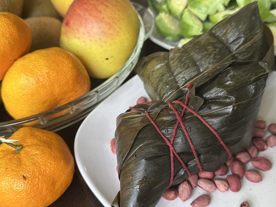 A traditional Chinese sticky rice dumpling filled with pork and salted egg yolk.