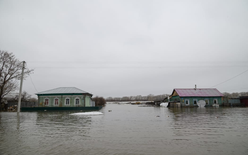 A view of the flooded settlement of Pokrovka, some 90 km from the city of Petropavl, in northern Kazakhstan close to the border with Russia on April 9, 2024. Water levels in overflowing rivers were still rising on April 9, 2024 in swathes of Russia and Kazakhstan that have been hit by massive floods, with Russia's city of Orenburg and western Siberia bracing for a new peak. Both Astana and Moscow have called the floods the worst in decades, introducing a state of emergency as water covered entire cities and villages. More than 100,000 people have been evacuated from the rising water -- mostly in Kazakhstan. (Photo by Evgeniy Lukyanov / AFP)