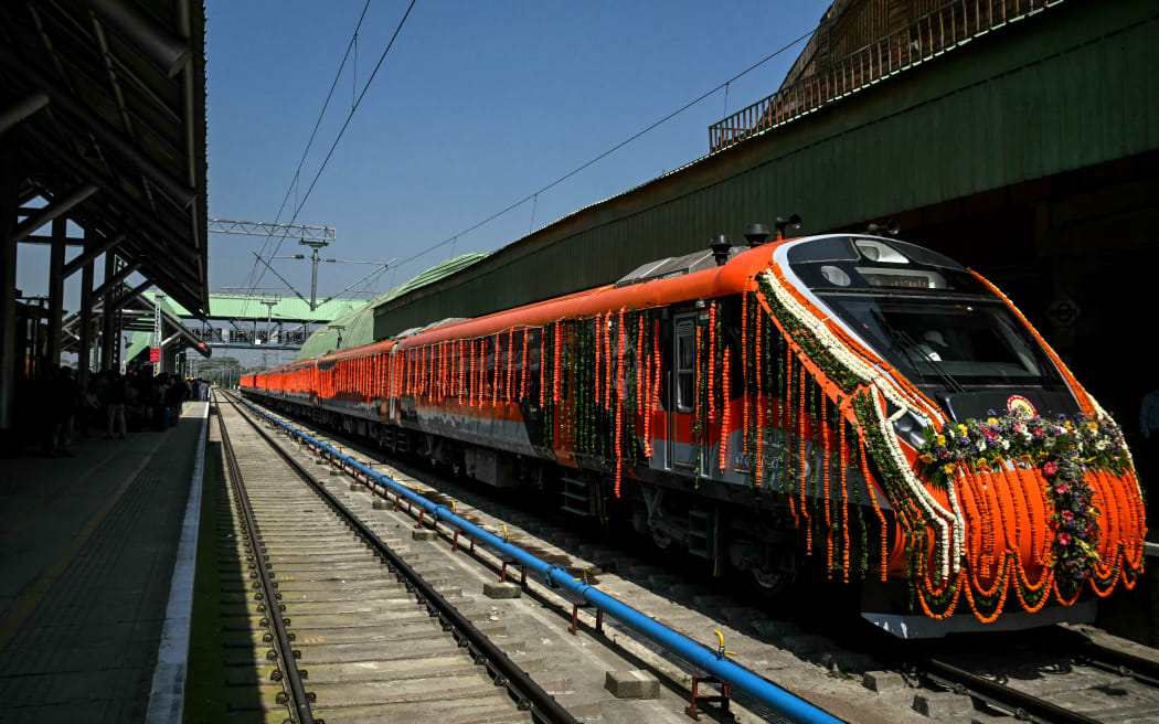 A decorated Vande Bharat passenger train is pictured at the Srinagar railway station in Srinagar on June 6, 2025, ahead of the inauguration of the Kashmir rail link by Indian Prime Minister Narendra Modi. (Photo by TAUSEEF MUSTAFA / AFP)
