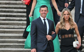 (FILES) Europe's Northern Irish golfer, Rory McIlroy (L) and wife Erica Stroll arrive for a team photo on the Spanish Steps after an official Team photo ahead of the 44th Ryder Cup at the Marco Simone Golf and Country Club in Rome on September 27, 2023. McIlroy has filed for divorce from wife Erica, submitting the documents on Monday in Florida to end their marriage after just over seven years, celebrity website TMZ reported on May 14, 2024.