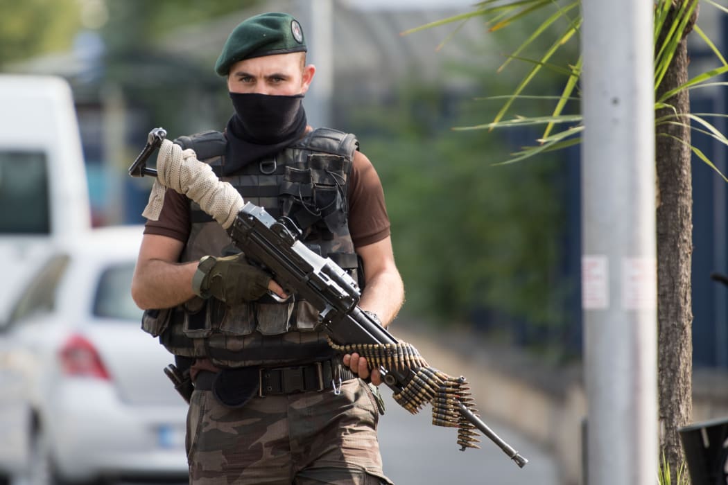 A special police officer stands guard during an operation at the Attatürk Airforce Acadamy in Istanbul, Turkey, following the failed coup attempt.