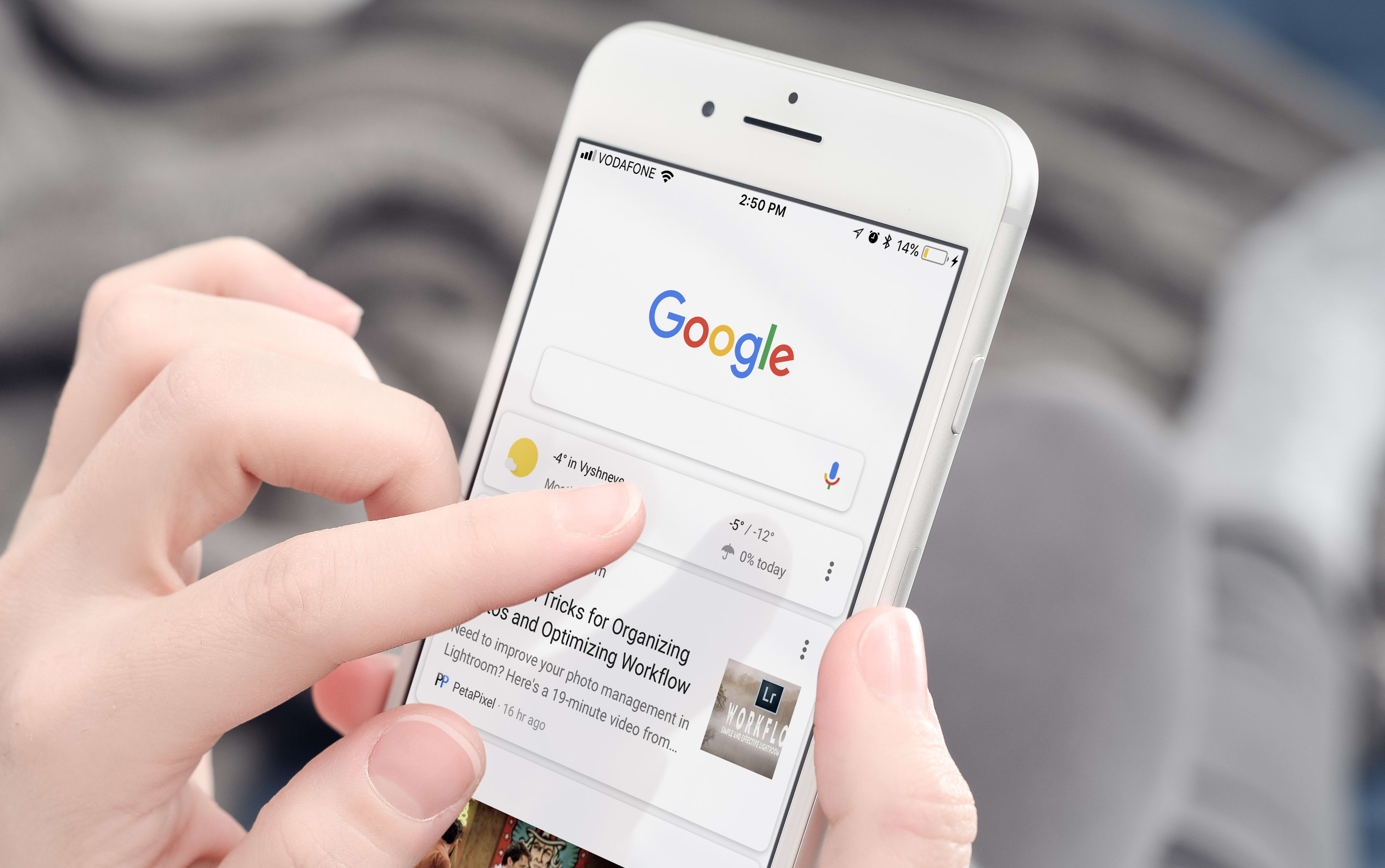 Kyiv, Ukraine - January 24, 2018: Woman using Google app on  Apple iPhone 8 plus at home. Google it is the most-used search engine on the World Wide Web,