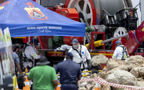 Rescuers use a Metalliferous Mobile Rescue Winder during a rescue operation to retrieve illegal miners from an abandoned gold mine in Stilfontein on 14 January, 2025. More than two dozen illegal miners have been rescued and at least 15 bodies recovered from an abandoned gold mine in South Africa, as operations continued on 14 January, 2025 to reach potentially dozens more people who have been underground for months.
