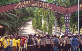 Indonesian police stop a protest by West Papuan students at Cenderawasih University in Jayapura, 28 September 2020.