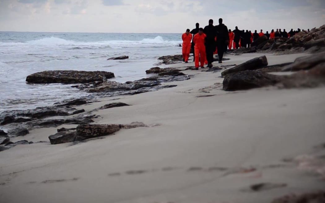 An image grab purportedly shows Islamic State fighters leading handcuffed hostages, said to be Egyptian Coptic Christians, before their alleged decapitation on a seashore near the Libyan capital of Tripoli.