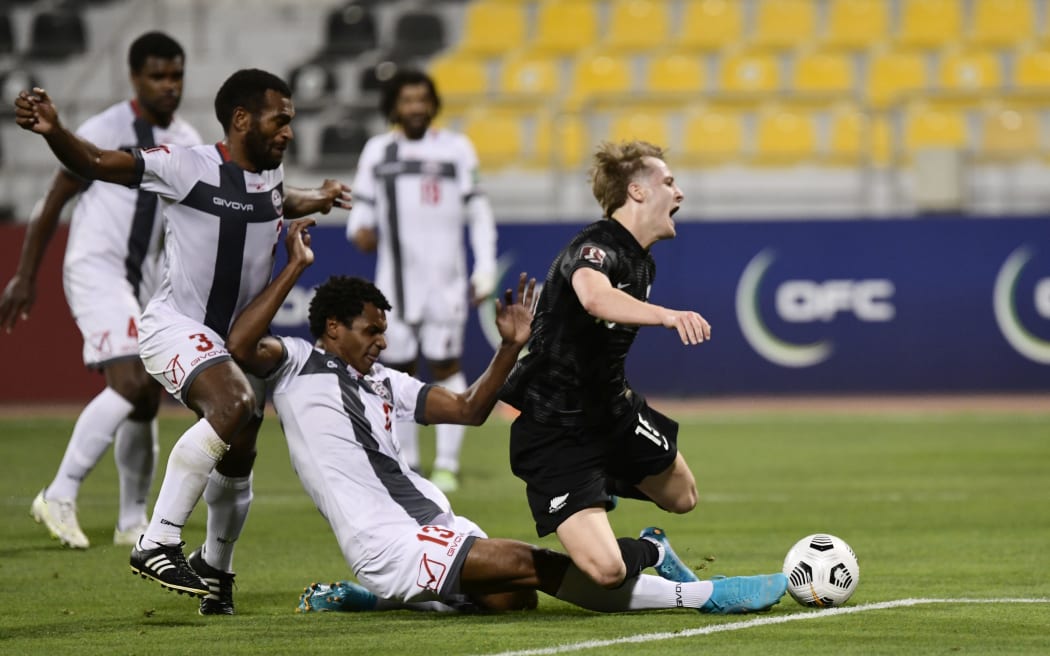 Alex Greive is brought down for a penalty - New Zealand All Whites v New Caledonia. 2022.