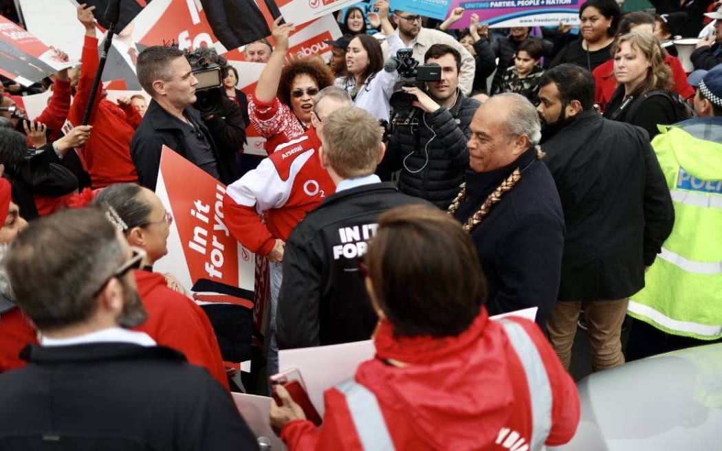 Labour supporters and Vision NZ protesters followed Chris Hipkins around the Ōtara Markets.