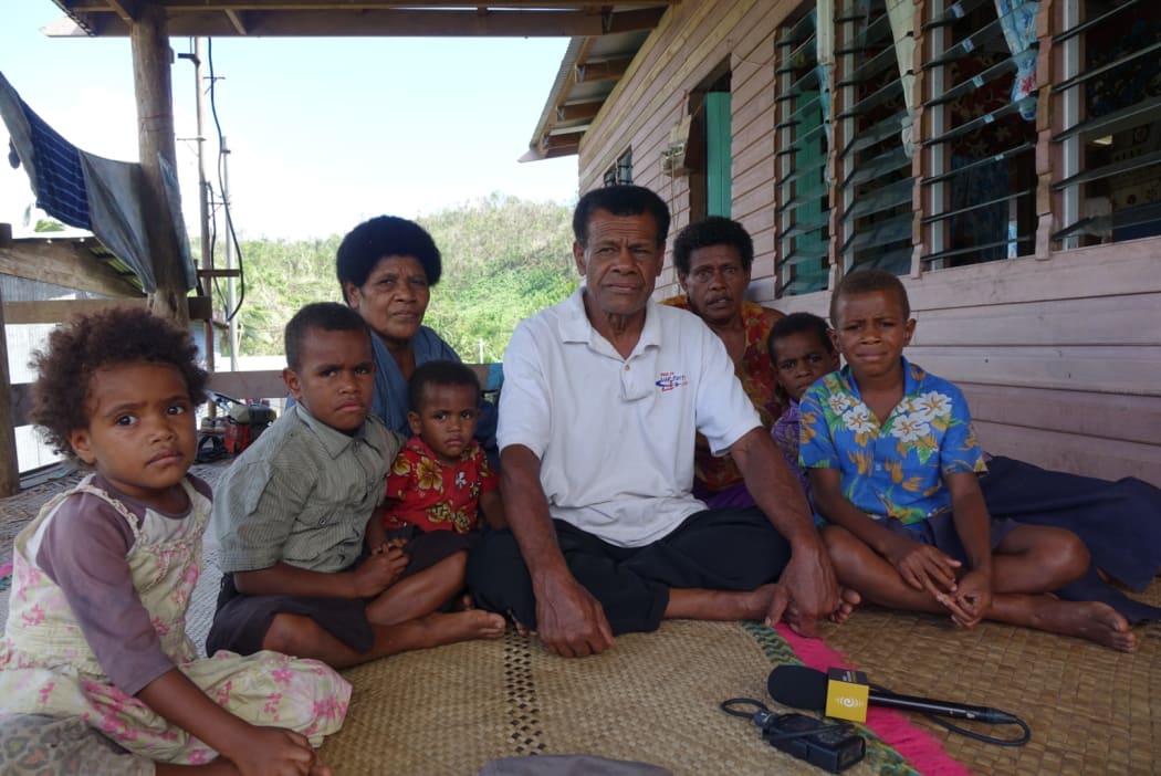 The chief of Nawaisomo Ratu Waisea Drakusiwale with villagers