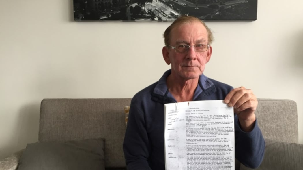 Brent Mitchell holds one of the files he was able to obtain from child welfare authorities in Manitoba. He just returned to Canada for the first time since being sent to foster care in New Zealand in 1963.