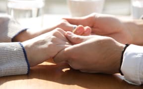 Holding hands.