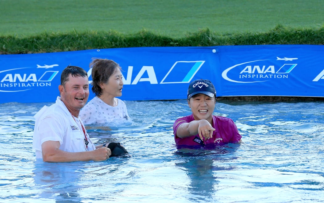 Lydia Ko celebrates her win at the ANA Inspiration with the winner's jump in the 18th lake alongside her caddie, mother and sister.