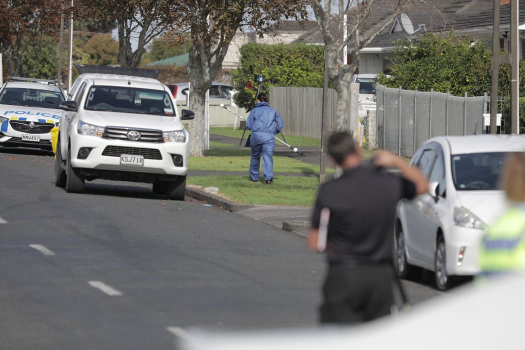 Police at Central Avenue in Papatoetoe after a man wielding a machete was shot dead.