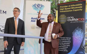 Papua New Guinea Prime Minister James Marape (right) celebrates the launch of the Coral Sea Cable Project with Australian High Commissioner Jon Philp in Port Moresby, 5 June 2020.